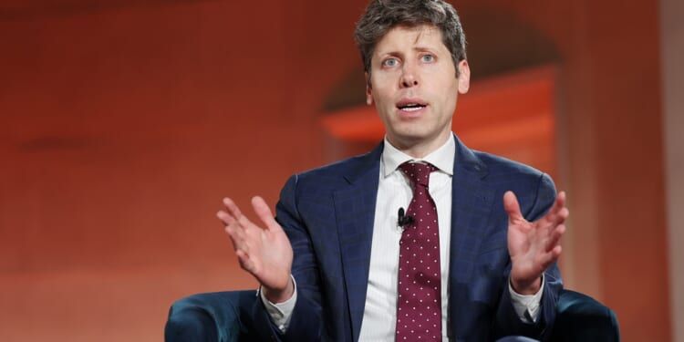 OpenAI CEO Sam Altman speaking while seated