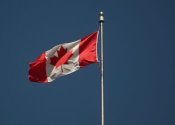 The Canadian flag flies in Montreal, Quebec, Canada.
