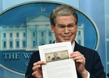 Treasury Secretary Scott Bessent shows a proposed $250 bill featuring President Donald Trump during a press briefing Thursday at the White House in Washington, D.C.