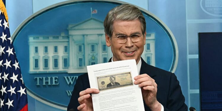 Treasury Secretary Scott Bessent shows a proposed $250 bill featuring President Donald Trump during a press briefing Thursday at the White House in Washington, D.C.