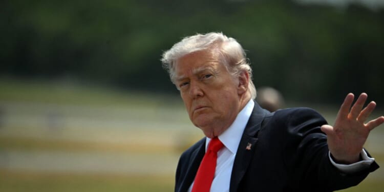 President Donald Trump waves after his arrival at Ocala International Airport, in Ocala, Florida, on May 1, 2026.