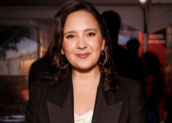 Bari Weiss is pictured smiling at a dinner reception.