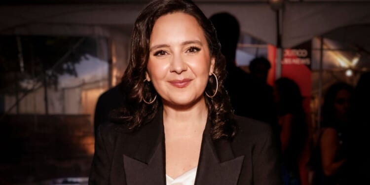 Bari Weiss is pictured smiling at a dinner reception.