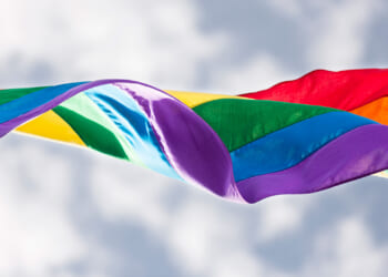 a pride flag in the wind