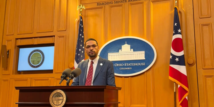 State Rep. Josh Williams stands behind the podium as he introduces a bill inside the Harding Senate Briefing Room.