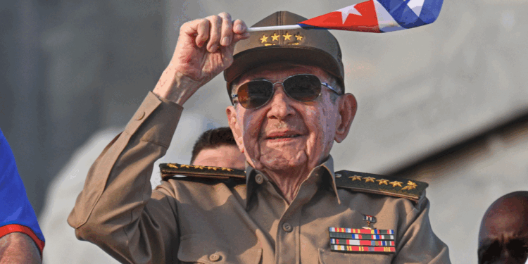 Raul Castro waves the Cuban flag.