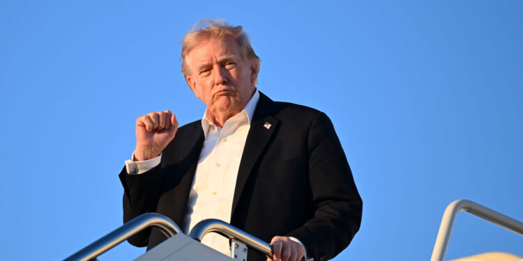 U.S. President Donald Trump disembarks from Air Force One upon arrival from Miami on May 3, 2026 at Joint Base Andrews, Florida. Trump spent the weekend at his Mar-a-Lago resort in Doral, Florida. (Photo by Roberto Schmidt/Getty Images)
