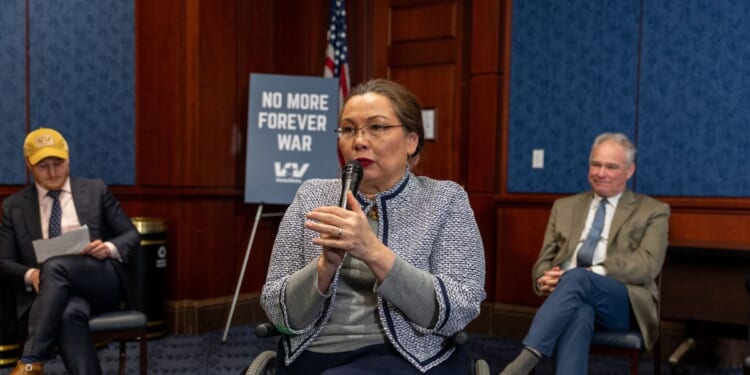 Sen. Tammy Duckworth speaks with veterans about the Iran war at Capitol Hill on March 18, 2026, in Washington, D.C.