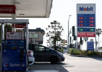 Vehicles park at a Mobil gas station in Redondo Beach, California on April 30, 2026.