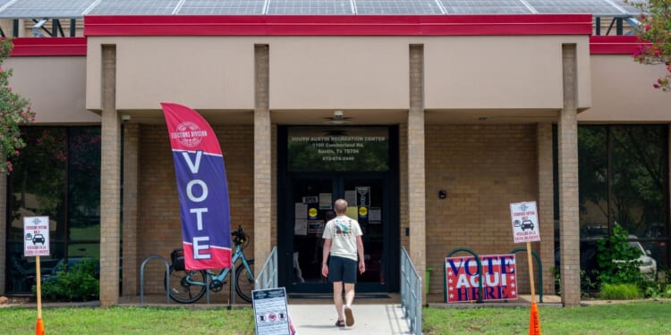 A person prepares to vote at the South Austin Recreation Center on May 26, 2026, in Austin, Texas.