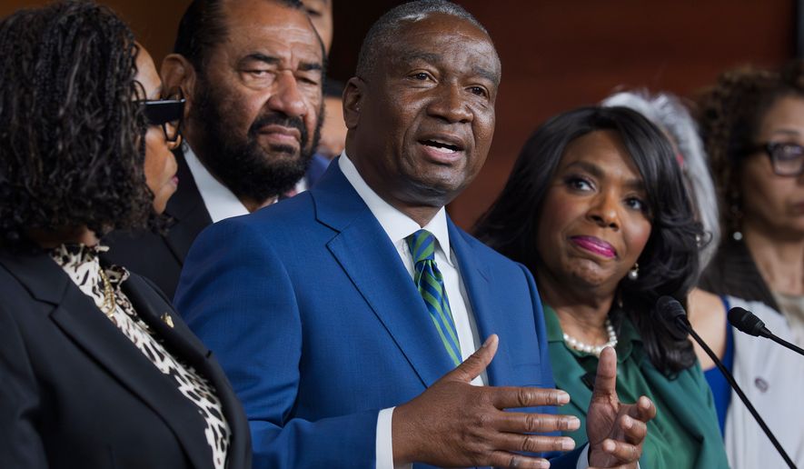 Rep. Cleo Fields, D-La., center, who represents Louisiana's 6th congressional district, is joined by members of the Congressional Black Caucus as they speak to reporters in the wake of the Supreme Court ruling to strike down his majority Black congressional district in Louisiana, at the Capitol in Washington, Wednesday, April 29, 2026. (AP Photo/J. Scott Applewhite)