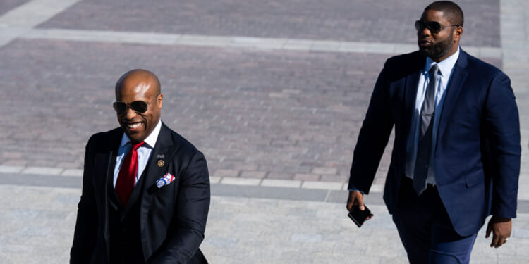 Rep. Wesley Hunt, R-Texas, left, and Rep. Byron Donalds, R-Fla., walk up the House steps at the Capitol.