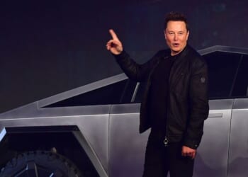 Tesla CEO Elon Musk gestures while introducing the newly unveiled all-electric battery-powered Tesla Cybertruck at Tesla Design Center in Hawthorne, California, on Nov. 21, 2019.