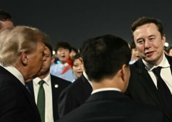 President Donald Trump presents SpaceX, Twitter and electric car maker Tesla CEO Elon Musk to China's Vice President Han Zheng at Beijing Capital Airport in Beijing on May 13, 2026.
