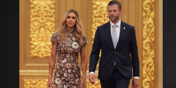 Eric Trump, right, and his wife Lara arrive at a state dinner for President Donald Trump and Chinese President Xi Jinping at the Great Hall of the People on Thursday in Beijing.