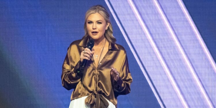 Turning Point USA CEO Erika Kirk speaks at the annual AmericaFest conference, in remembrance of late right-wing political activist Charlie Kirk, in Phoenix, Arizona, on Dec. 21, 2025.