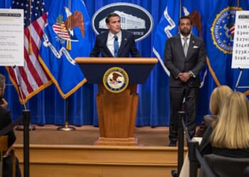 Acting Attorney General Todd Blanche stands and announces initiative against the SPLC alongside FBI Director Kash Patel on April 21, 2026.