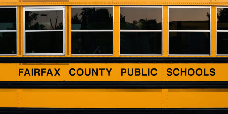 Side of a yellow Fairfax County Public Schools bus.