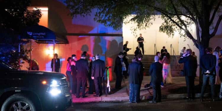 Guests evacuate the Washington Hilton during the White House Correspondents' Dinner after gunshots rang out on April 25, 2026, in Washington, D.C.