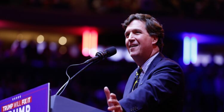 Tucker Carlson speaks before President Donald Trump takes the stage at the campaign rally at Madison Square Garden on Oct. 27, 2024, in New York City.