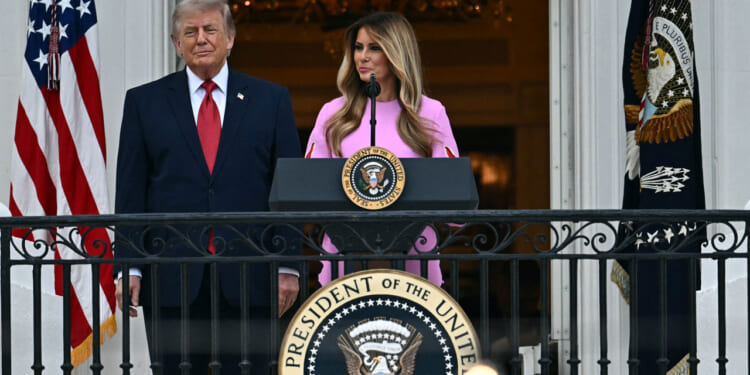 US First Lady Melania Trump, accompanied by President Donald Trump, speaks during the Congressional Picnic on the South Lawn of the White House on May 19, 2026.