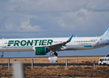 A Frontier plane can be seen as it taxis down the runway preparing for takeoff on November 25, 2025.
