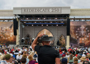 Attendees celebrate during "Rededicate 250: A National Jubilee of Prayer, Praise and Thanksgiving" on the National Mall in Washington, DC, on May 17, 2026.