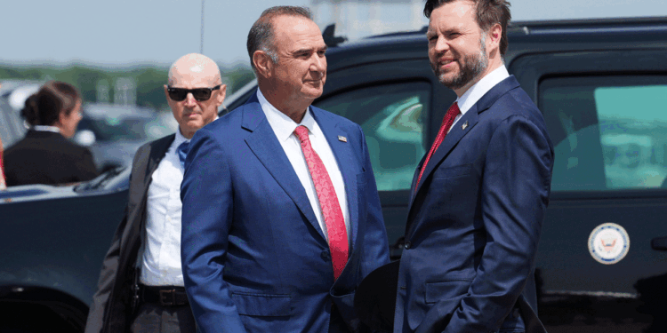 Missouri Governor Mike Kehoe (L) welcomes Vice President JD Vance as he arrives at Kansas City International Airport on May 18. (Eric Lee/Getty Images)