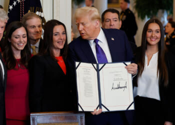 Mike Collins (L), President Donald Trump and the family of Laken Riley.