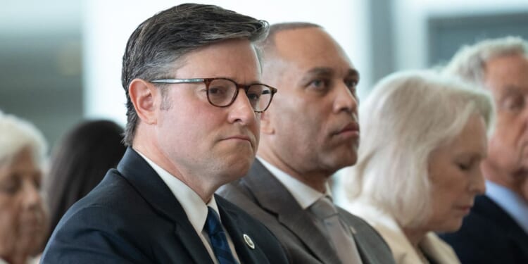 Speaker of the House Mike Johnson and House Minority Leader Hakeem Jeffries attend the United States Holocaust Memorial Museum's National Commemoration of the Days of Remembrance ceremony at the U.S. Capitol in Washington, D.C., on April 14, 2026.