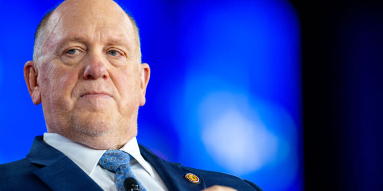 Close-up of Tom Homan against a blue backdrop.