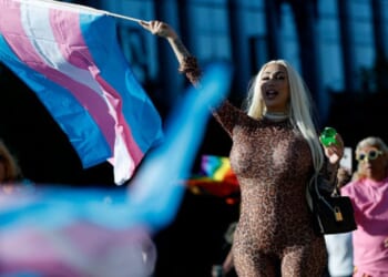 The transgender flag waves as a participant of the 21st San Francisco Annual Trans March holds it while screaming on June 27, 2025.