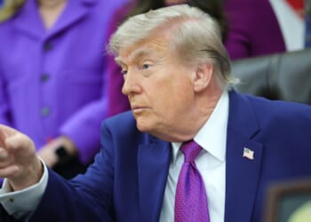 President Donald Trump sits in the Oval Office during his maternal healthcare announcement on May 11, 2026.