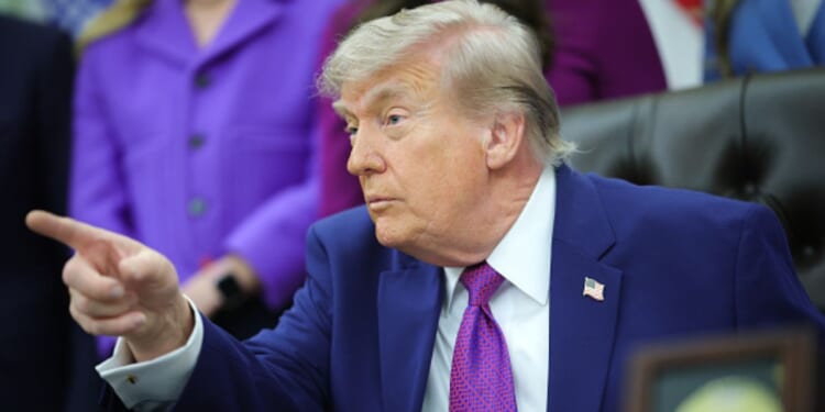 President Donald Trump sits in the Oval Office during his maternal healthcare announcement on May 11, 2026.