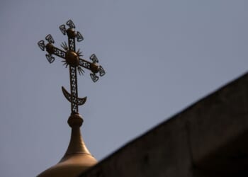A cross sits on top of the Dulab Mausoleum in Tehran.