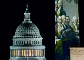 The United States Capitol Building flanks the Washington Monument on December 31, 2025.