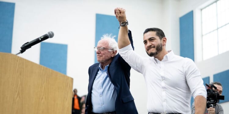 Sen. Bernie Sanders is introduced by Senate candidate Abdul El-Sayed at Mumford High School on May 3, 2026, in Detroit, Michigan.