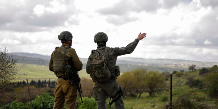 Israeli soldiers patrol along the Israel-Lebanon border on April 10, 2026.