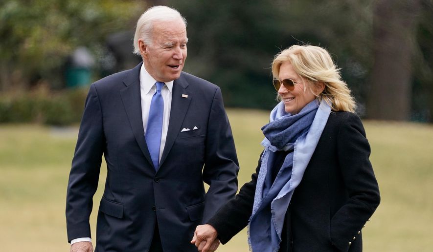 President Joe Biden and first lady Jill Biden arrive on the South Lawn of the White House, Jan. 23, 2023, in Washington. (AP Photo/Evan Vucci, File)