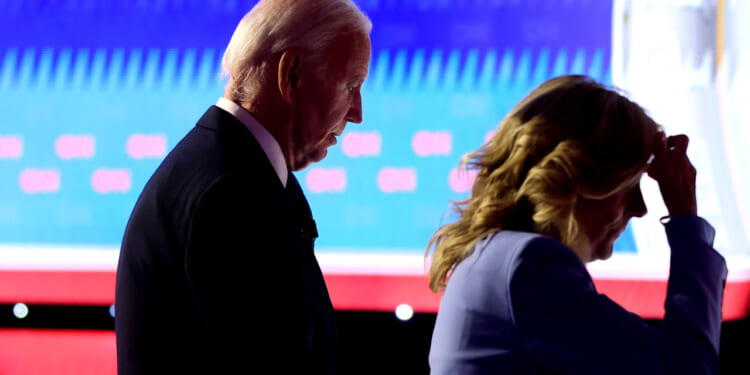 President Joe Biden walks off with first lady Jill Biden following the CNN Presidential Debate at the CNN Studios on June 27, 2024 in Atlanta, Georgia. (Photo by Justin Sullivan/Getty Images)