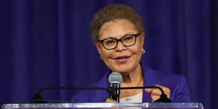 Los Angeles Mayor Karen Bass speaks into a microphone.