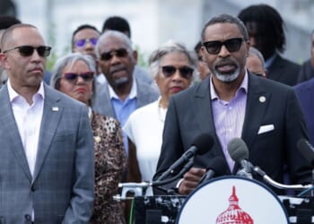 House Minority Leader Hakeem Jeffries looks on as NAACP President Derrick Johnson speaks during a news conference in opposition to the SCORE Act in front of the U.S. Capitol on May 19, 2026, in Washington, D.C.