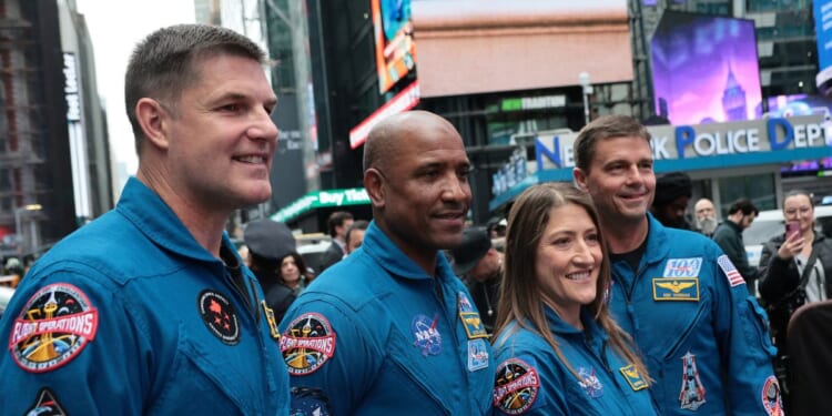 The Artemis II astronauts, mission specialist Jeremy Hansen of the Canadian Space Agency, pilot Victor Glover, mission specialist Christina Koch, and commander Reid Wiseman pose for photos outside of the Nasdaq Marketside on April 30 in New York City.