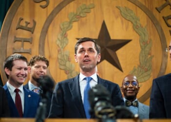 Mayes Middleton addresses the media in the Texas Capitol .
