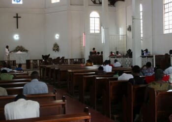 Christians sit in the pews of a Pentecostal church in Kampala, Uganda on July 20, 2009.