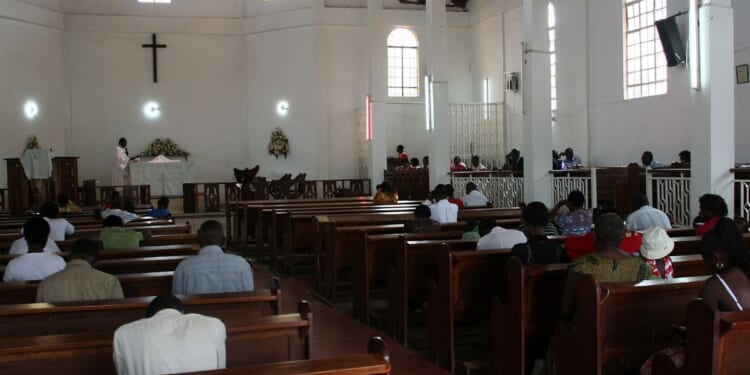 Christians sit in the pews of a Pentecostal church in Kampala, Uganda on July 20, 2009.