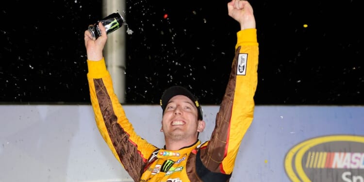 Driver Kyle Busch celebrates in the victory lane after winning the NASCAR Sprint Cup Series AdvoCare 500 at Atlanta Motor Speedway on Sept. 1, 2013 in Hampton, Georgia.