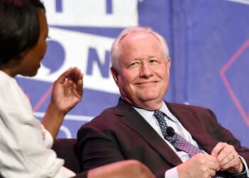Joy-Ann Reid and Bill Kristol at a panel during Politicon at Pasadena Convention Center on July 29, 2017, in Pasadena, California.