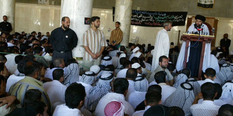 Radical Shiite cleric Moqtada al-Sadr gives a speech during the Friday noon prayers in the central mosque of Kufa.