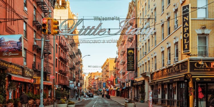 A low angle view of a Little Italy street sign in New York City.